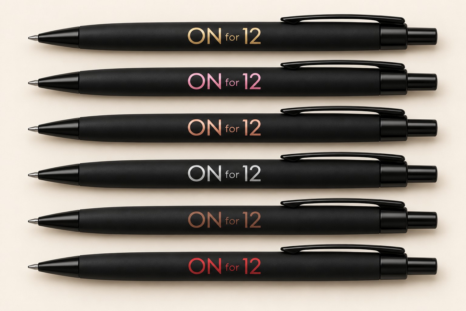 Six black ON for 12 pens with gold, pink, rose gold, silver, brown, and red lettering